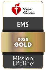 American Heart Association badge with a red heart logo, text "EMS 2026 GOLD," and "Mission: Lifeline" on a gold and black background.